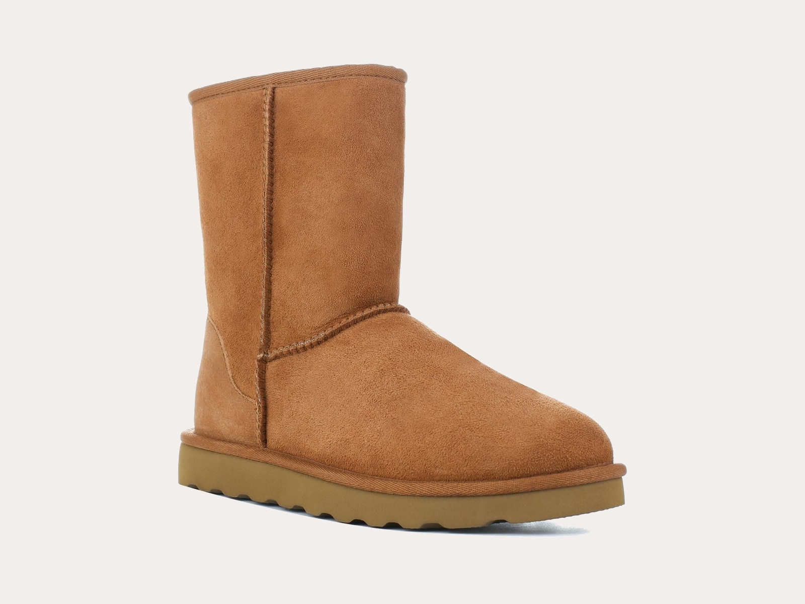 Classic chestnut sheepskin boot product image on a warm neutral background
