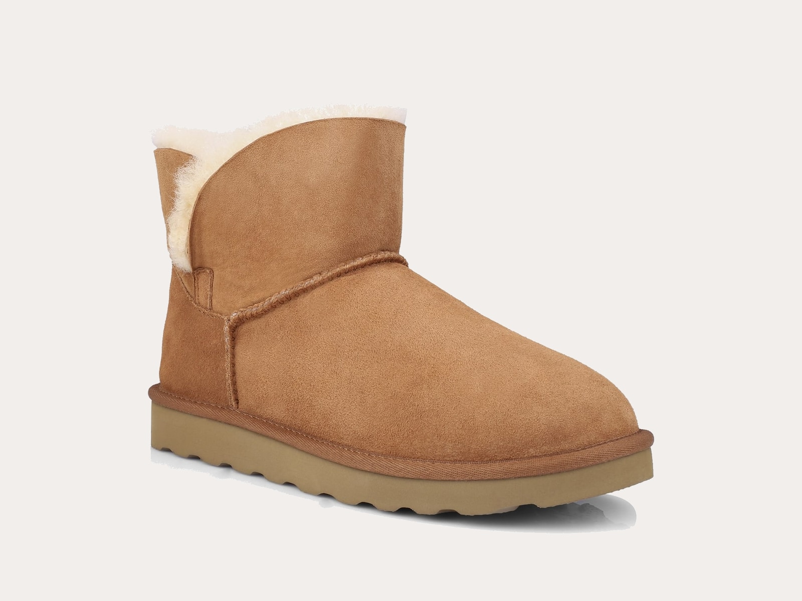 Short chestnut sheepskin boot product image on a warm neutral background